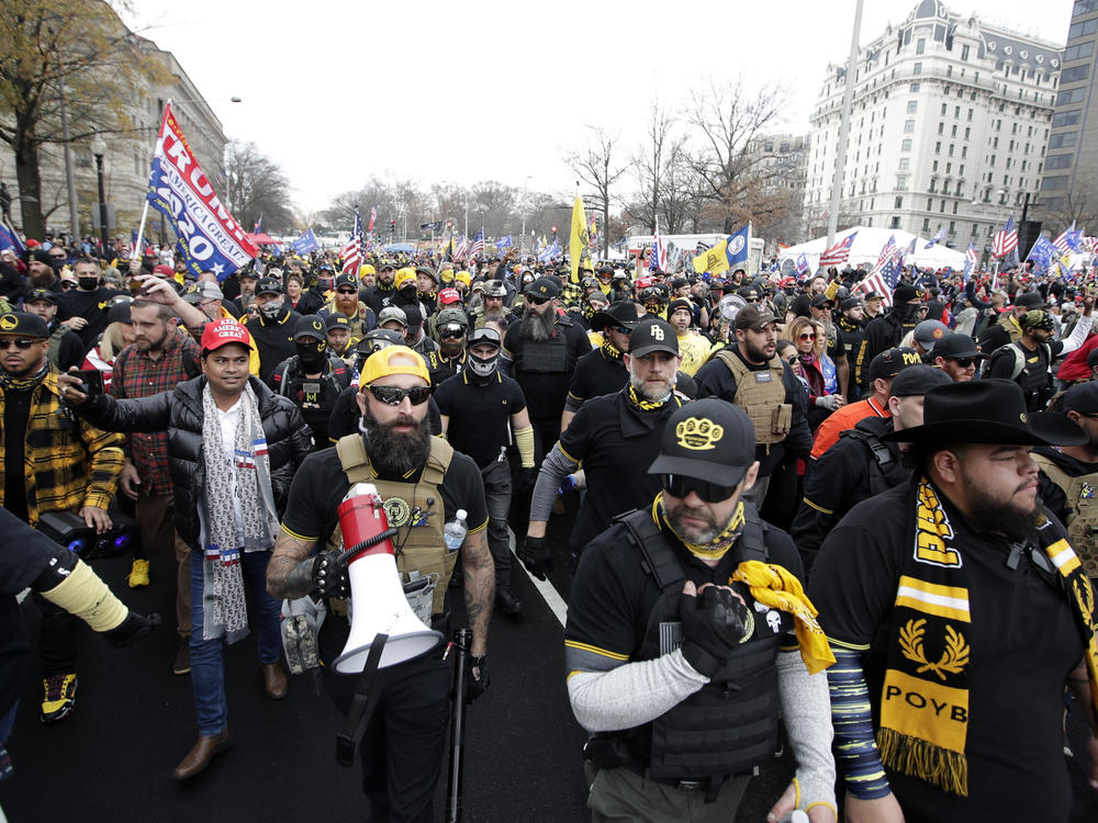 Supporters of President Donald Trump wearing attire associated with the Proud Boys attend a rally at Freedom Plaza, Dec. 12, 2020, in Washington. A judge on Friday awarded more than $1 million to a Black church in downtown Washington that sued the far-right Proud Boys for tearing down and burning a Black Lives Matter banner during a 2020 protest.
