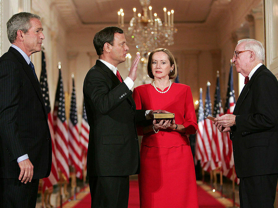 John Roberts is sworn in as U.S. Supreme Court chief justice on Sept. 29, 2005, at the White House by Justice John Paul Stevens with Roberts' wife, Jane, and then-President George W. Bush.