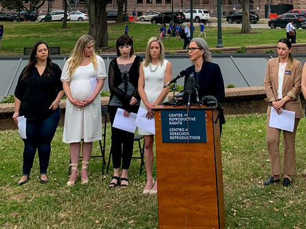 Lauren Miller (second from left) attends a Center for Reproductive Rights news conference announcing the lawsuit she and 14 other women are bringing against Texas.