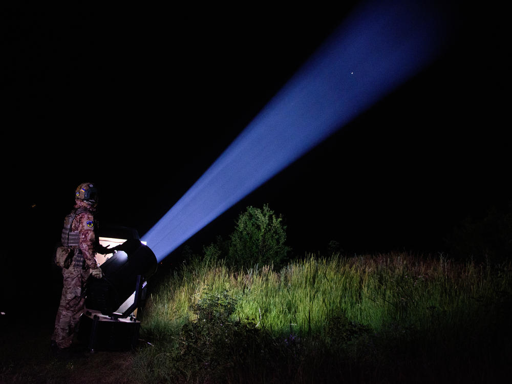 A member of a Ukrainian mobile air defense team scans the sky near the southern port city of Odesa for an incoming Russian attack. Using a mix of old Soviet and new Western air defense systems, Ukraine shoots down the vast majority of Russian missiles and drones and has managed to keep Russia's much larger air force from achieving air superiority.