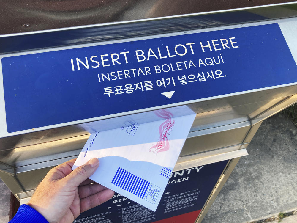 FILE - A ballot and voting drop box are in Rutherford, New Jersey, on Friday, October 21, 2022.