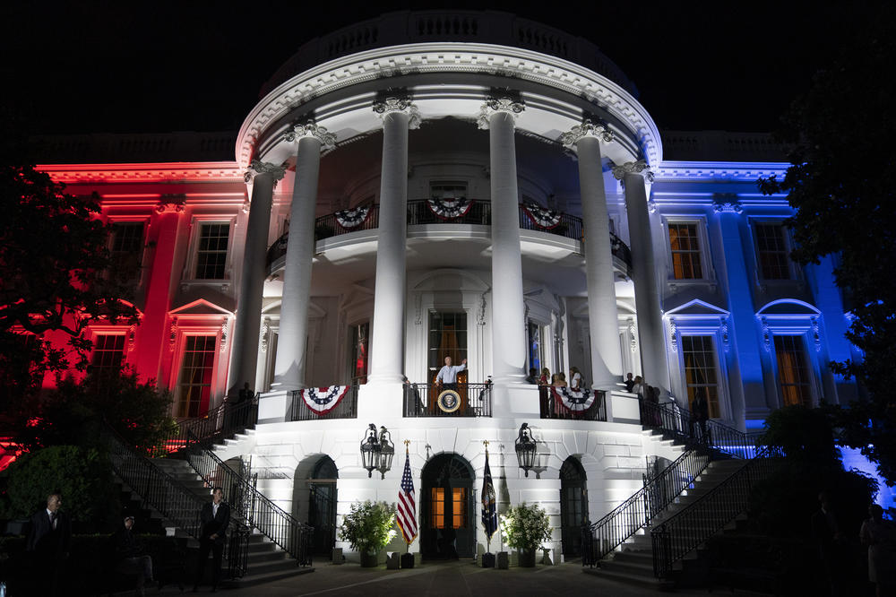 President Biden waves to a crowd after a fireworks show during the Fourth of July celebration at the White House in 2022.