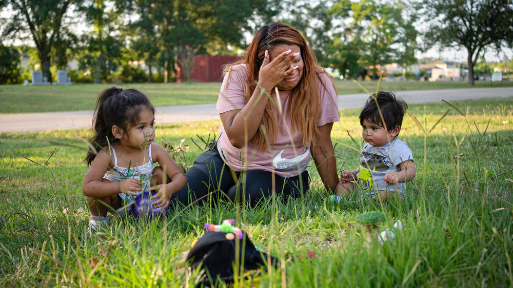 Samantha Casiano, 29, cries at the gravesite of her daughter, Halo Hope Villasana, alongside daughter Camila, 2, and Louie, who celebrated his first birthday earlier that day.
