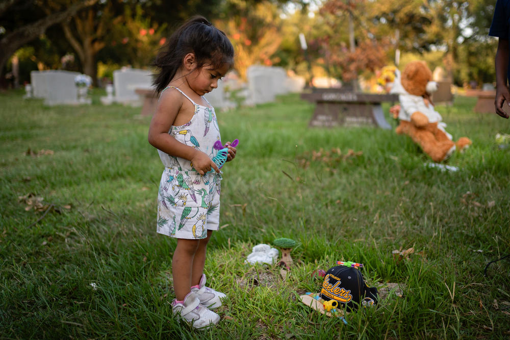 Camila Villasana at the grave of her sister, Halo. 