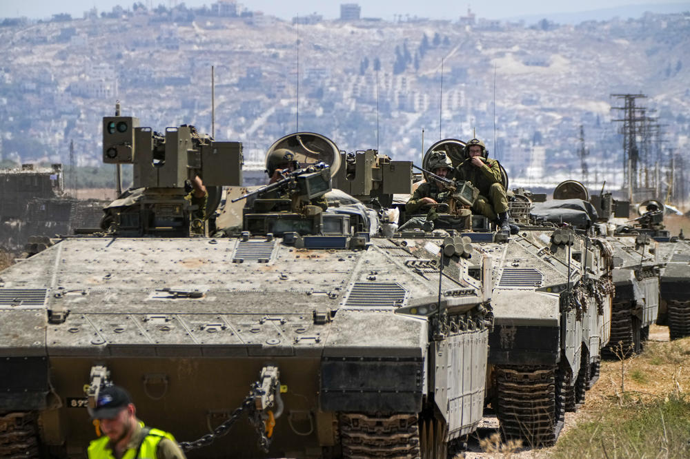 Israeli soldiers drive an APC out of the occupied West Bank city of Jenin, during an Israeli military raid of the Jenin refugee camp where Israel says there is a militant stronghold, Tuesday.