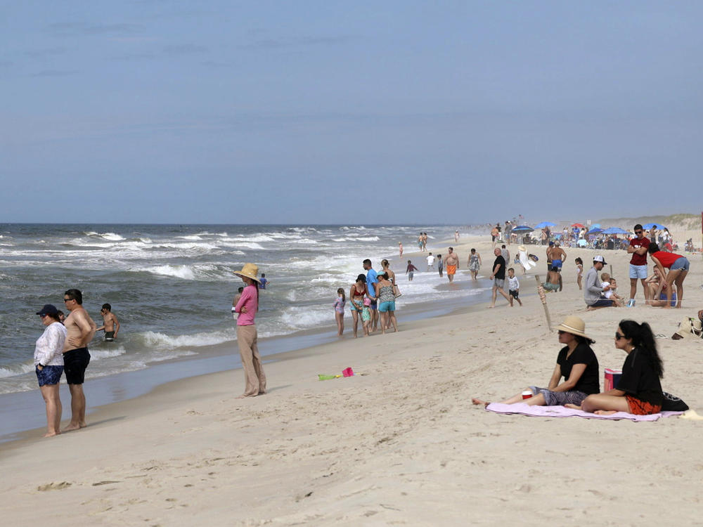 People are seen at Field 3 at Robert Moses State Park in West Islip, N.Y., Tuesday, July 4, 2023.