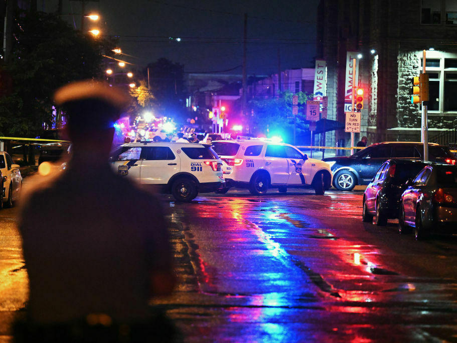 Police work the scene of a July 3 shooting in the Kingsessing section of Philadelphia.