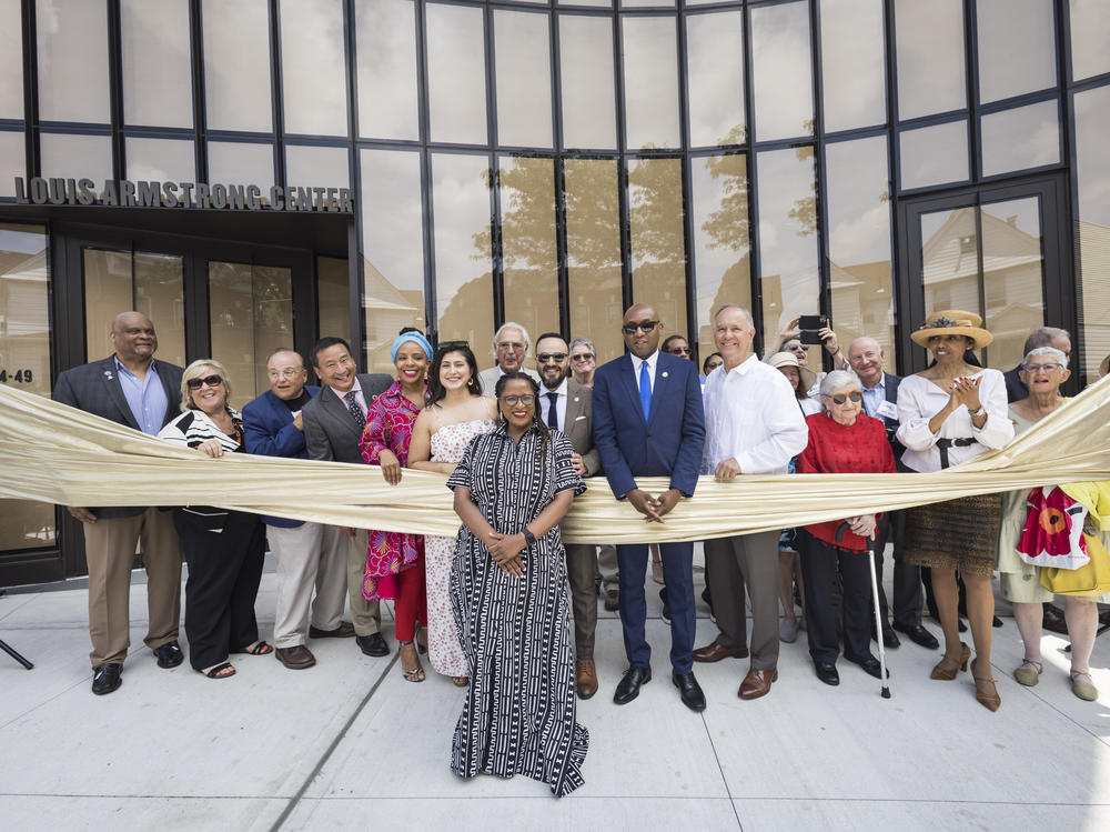 Regina Bain, executive director of the Louis Armstrong House Museum, leads a ribbon-cutting for the brand-new Louis Armstrong Center on June 29 in Queens, New York.