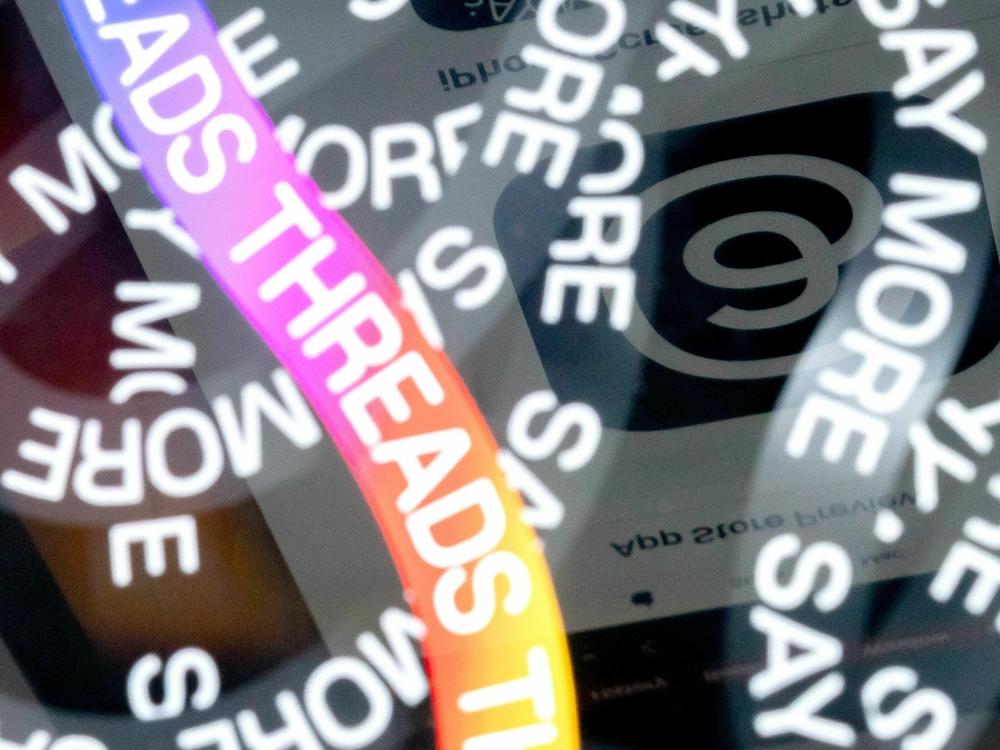 A photo illustration shows the logo for Meta's Threads, an app that gained over 10 million users overnight.