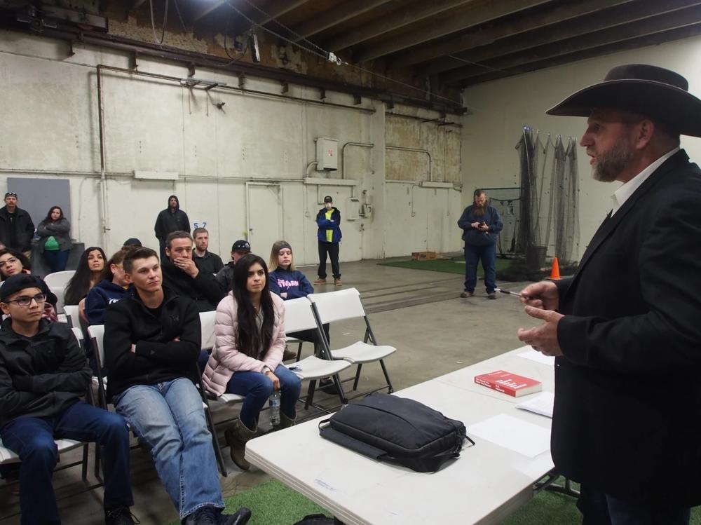 Ammon Bundy speaks to a crowd of supporters in 2020 during the COVID-19 lockdown.