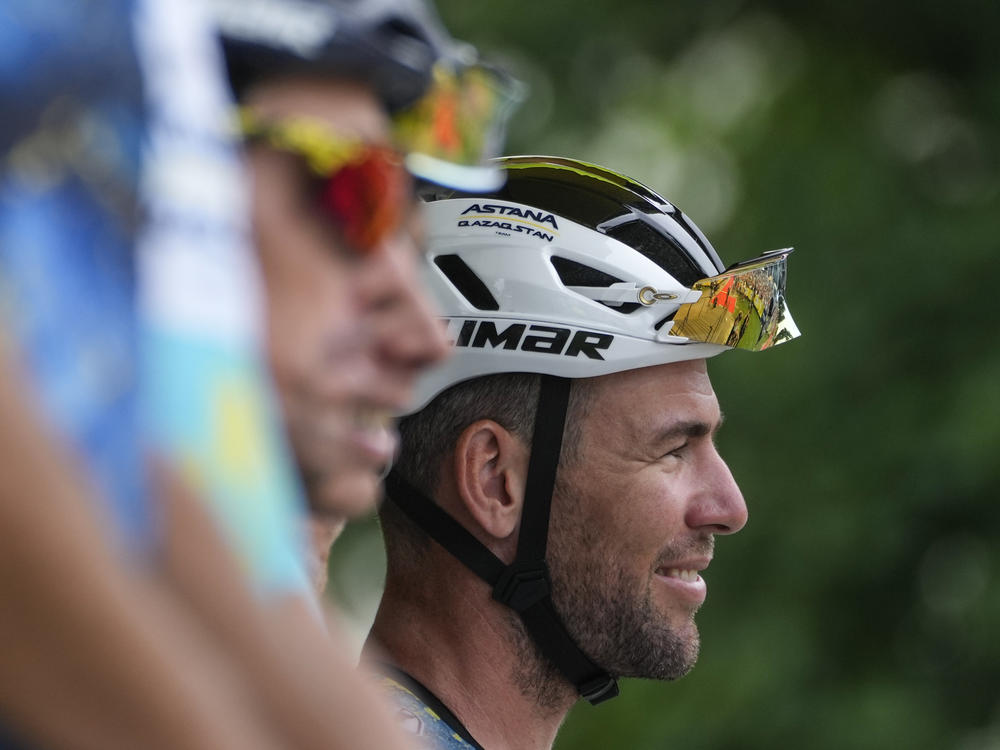 Britain's Mark Cavendish (right) smiles prior to the fourth stage of the Tour de France in Nogaro, France on Tuesday. The ace sprinter crashed out of the race during the eighth stage on Saturday.