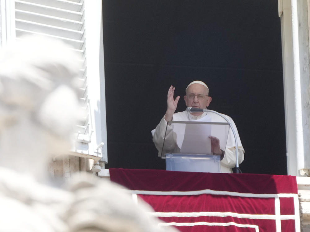 Pope Francis delivers the Angelus noon prayer in St. Peter's Square at the Vatican on Sunday.