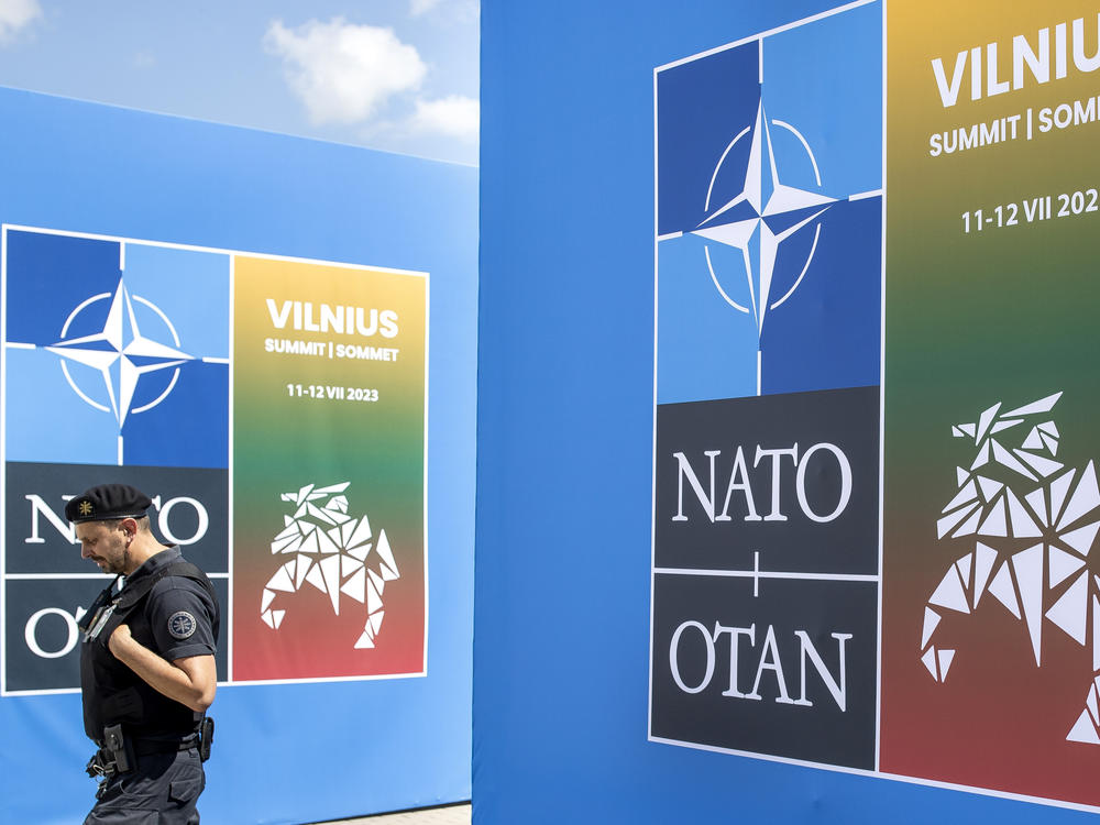 A security guard walks in front of the venue in Vilnius, Lithuania where the NATO summit will be held this week.