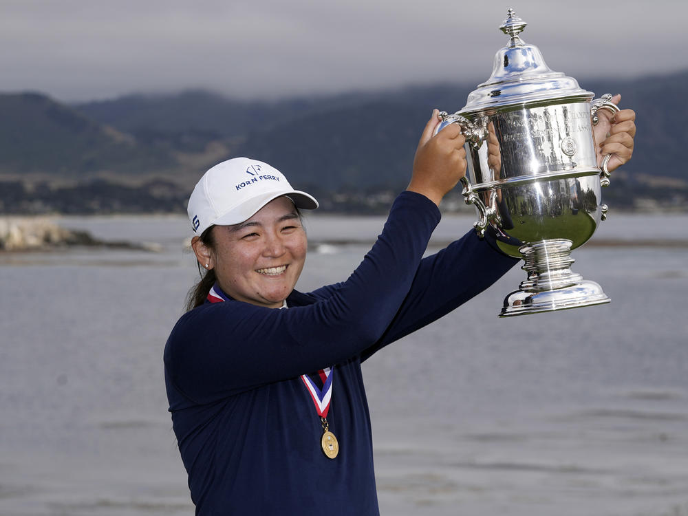 Allisen Corpuz poses with the winner's trophy after the U.S. Women's Open golf tournament at the Pebble Beach Golf Links, Sunday, July 9, 2023, in Pebble Beach, Calif.