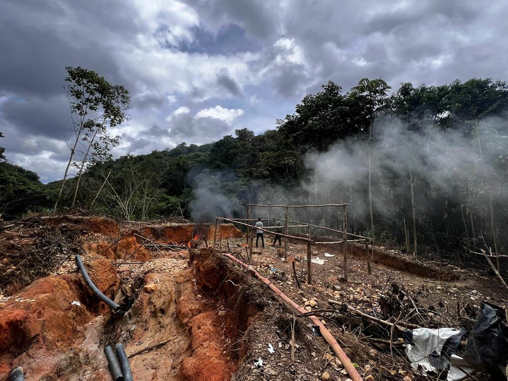 An officer of the Brazilian Institute of Environment and Renewable Natural Resources (IBAMA) takes part in an operation against Amazon deforestation at an illegal mining camp, known as garimpo, at the Yanomami territory in Roraima State, Brazil, on February 24.