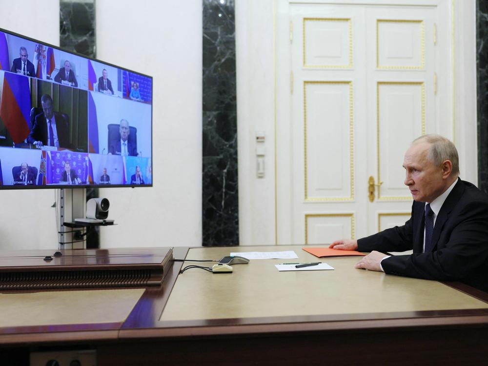 Russian President Vladimir Putin chairs a Security Council meeting via a video link at the Kremlin in Moscow on Friday.