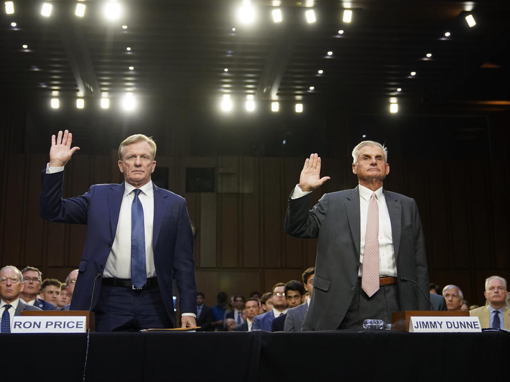 PGA Tour Chief Operating Officer Ron Price, left, and PGA Tour board member Jimmy Dunne are sworn in before testifying at a Senate hearing on the proposed PGA Tour-LIV Golf partnership on July 11.