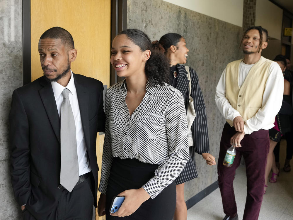 Kecalf Franklin, a son of music superstar Aretha Franklin leaves a court hearing with his family on Tuesday in Pontiac, Mich. A document handwritten by singer Aretha Franklin and found in her couch after her 2018 death is a valid Michigan will, a jury said Tuesday, a critical turn in a dispute that has turned her sons against each other.