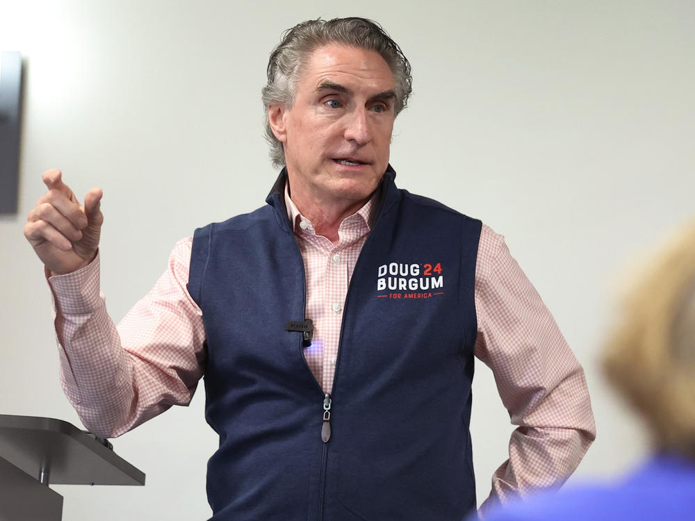 Republican presidential contender Doug Burgum, who's governor of North Dakota, is offering to send people $20 gift cards if they donate as little as $1 to his campaign. He's seen here last month speaking in Ankeny, Iowa.