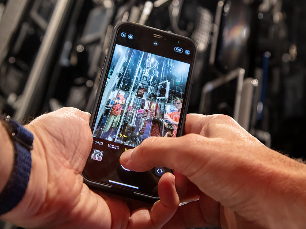 Museum visitors explore <em>Cellphone: Unseen Connections </em>at the Smithsonian's National Museum of Natural History.