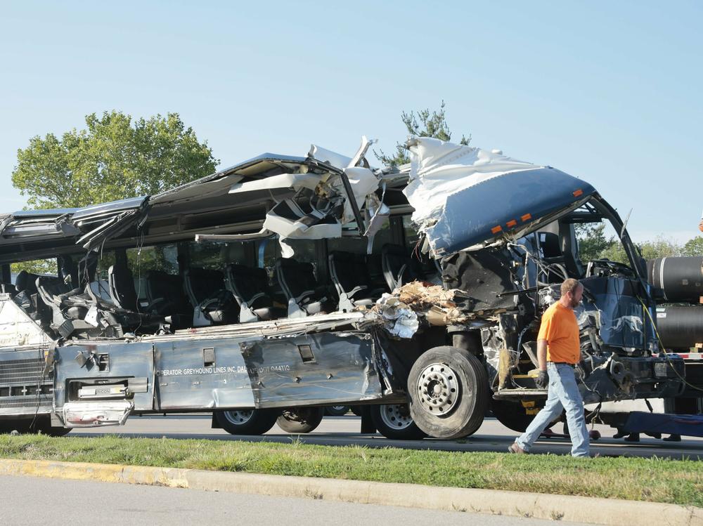 A Greyhound bus is pictured after it crashed into three commercial vehicles parked on a highway exit ramp in Highland, Ill., early Wednesday morning. The collision killed three people and injured at least 14 others.