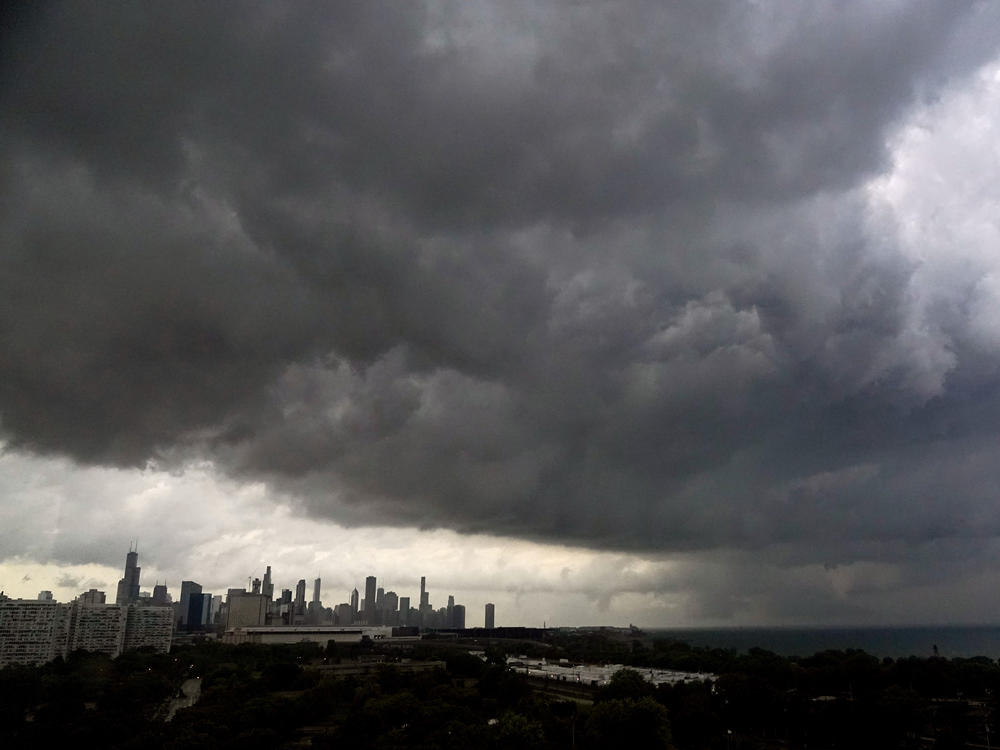 Storm clouds pass over downtown Chicago and the Bronzeville neighborhood of the city heading East out over Lake Michigan as the National Weather Service continued to issue multiple tornado warnings in the greater metropolitan area Wednesday, July 12, 2023.