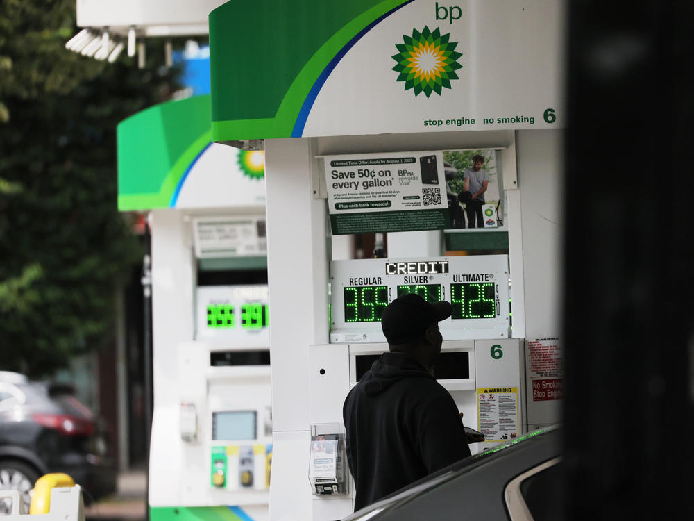 A person pumps gas at a BP gas station in Brooklyn, N.Y., on June 12. Annual inflation eased to 3% in June, the lowest in over two years, and there's hope that it could go lower.