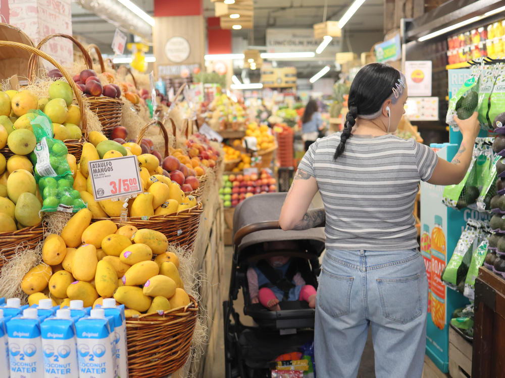 People shop at a market in Brooklyn, New York City, on June 12, 2023.