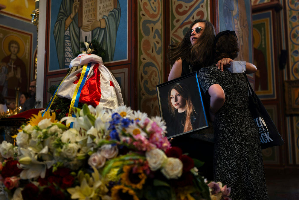 Holding a photo of Ukrainian writer Victoria Amelina, Sofia Cheliak hugs a woman during a memorial service for Amelina in Kyiv, Ukraine, on July 4. The award-winning writer died from her injuries after the June 27 Russian missile strike on a popular restaurant frequented by journalists and aid workers in eastern Ukraine.