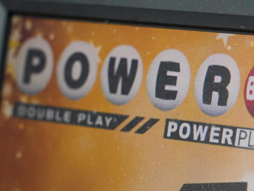 A display panel advertises tickets for a Powerball drawing at a convenience store, Nov. 7, 2022, in Renfrew, Pa. The Powerball jackpot soared to an estimated $875 million after no winning ticket was sold for Wednesday's drawing.