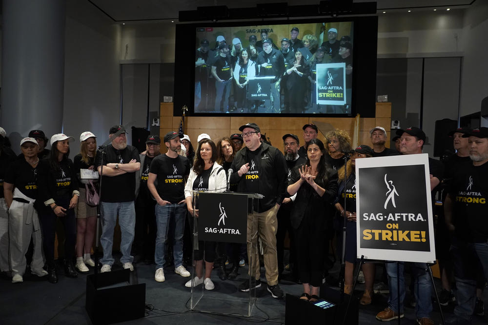 SAG-AFTRA president Fran Drescher, left, and SAG-AFTRA National Executive Director and Chief Negotiator Duncan Crabtree-Ireland, center, speak during a press conference announcing a strike on July, 13, 2023, in Los Angeles.