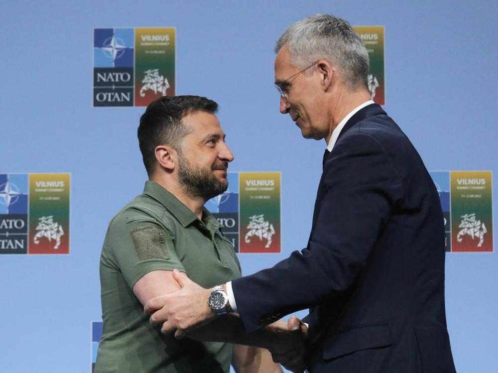 NATO Secretary-General Jens Stoltenberg, right, shakes hands with Ukrainian President Volodymyr Zelenskyy on Wednesday after a joint press conference at the NATO summit in Vilnius, Lithuania.