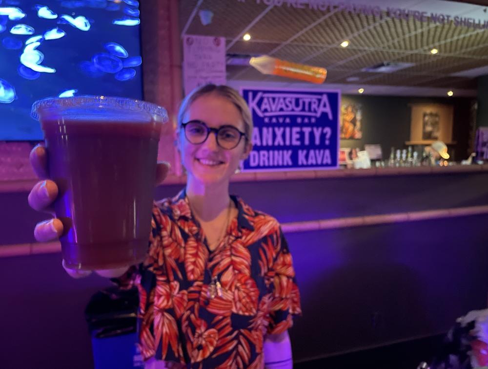 Behind the bar, Carlee Palermo, 25, keeps the kratom coming at Kavasutra. She says she drinks the tea to help with a degenerative condition in her spine.