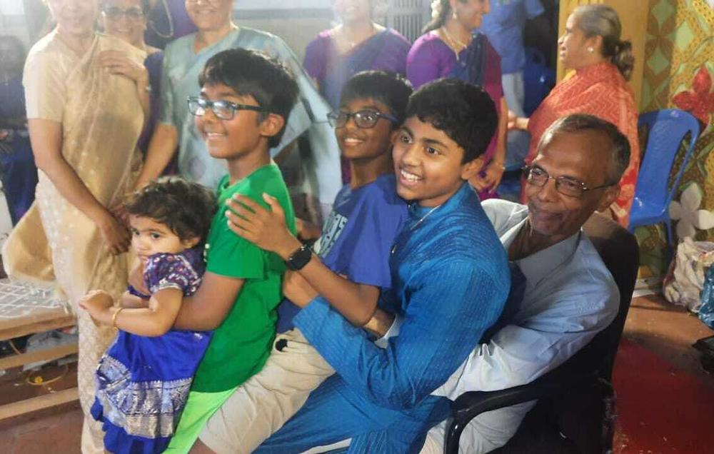 There was a lot of horsing around as kids in our family decided to sit on my uncle's lap at the same time.