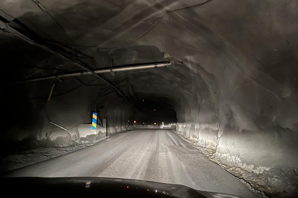 In the main tunnel into the LKAB mine, reflectors on the reinforced stone walls guide vehicles deep underground.