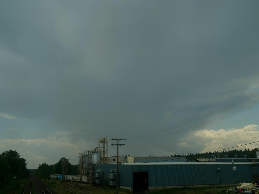 Smoke emerging from a wildfire is seen from a passenger train on the Prince George-Prince Rupert line near Telkwa, British Columbia, on Monday.