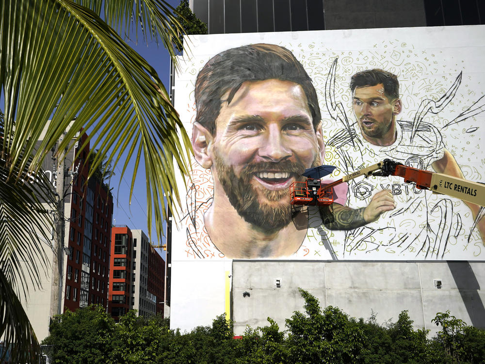 Artist Maximiliano Bagnasco paints a mural of Argentine soccer star Lionel Messi on July 10 in the Wynwood neighborhood of Miami.