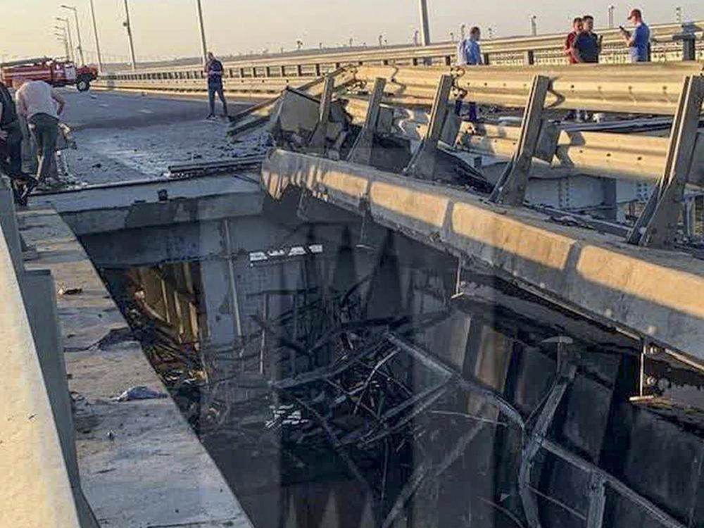 This photo released by Ostorozhno Novosti on Monday, July 17, 2023, reportedly shows damaged parts of an automobile link of the Crimean Bridge connecting Russian mainland and Crimean peninsula over the Kerch Strait not far from Kerch, Crimea.