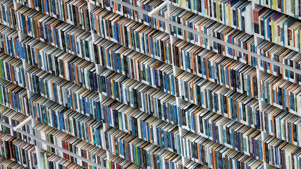 A visitor walks past books at the newly-opened Mohammed Bin Rashid library (MBRL) in Dubai in June 2022.