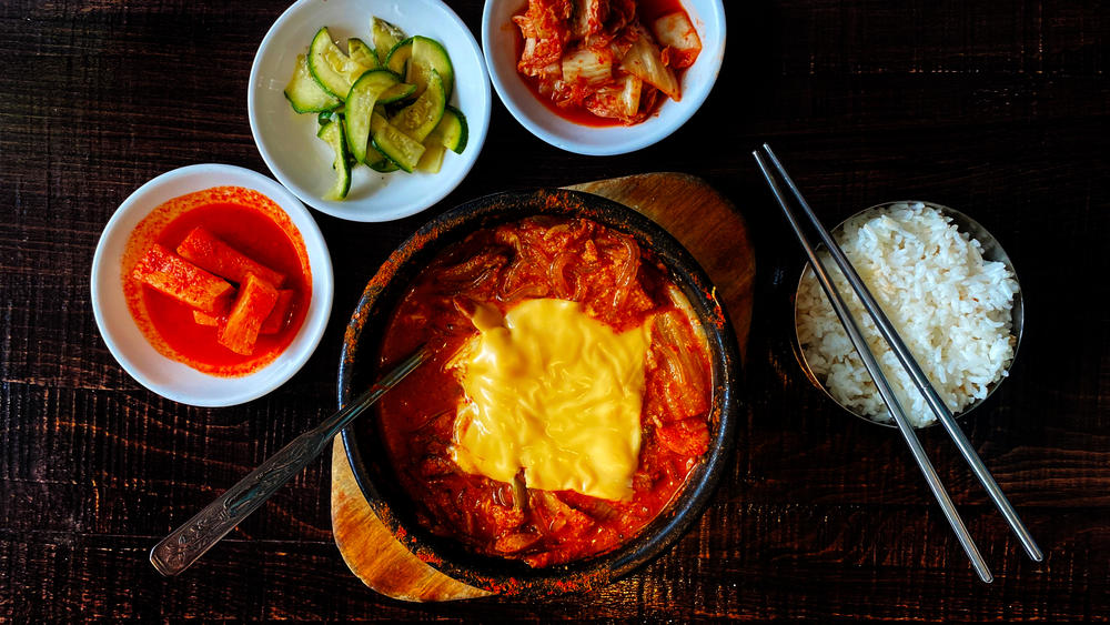 Budae jjigae, or army stew, is a Korean fusion stew that incorporates American style processed food.