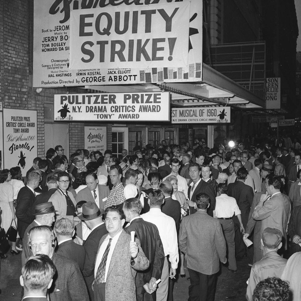 Cast members and spectators crowd the entrance to New York's Broadhurst Theater on June 2, 1960.