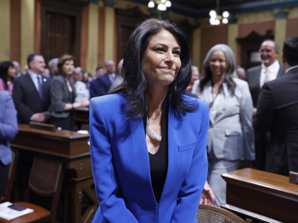 Michigan Attorney General Dana Nessel walks to her seat before the State of the State address on Jan. 25 at the state Capitol in Lansing, Mich.