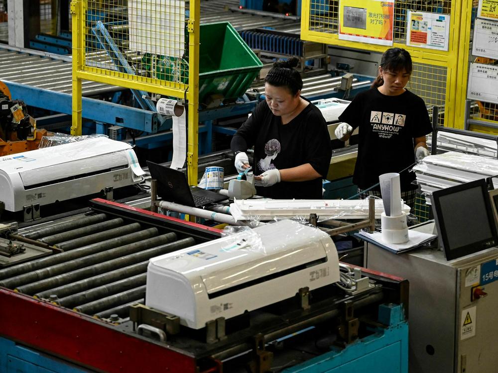 Employees working on an air conditioner production line at a Midea factory in Guangzhou, in China's southern Guangdong province, last July.