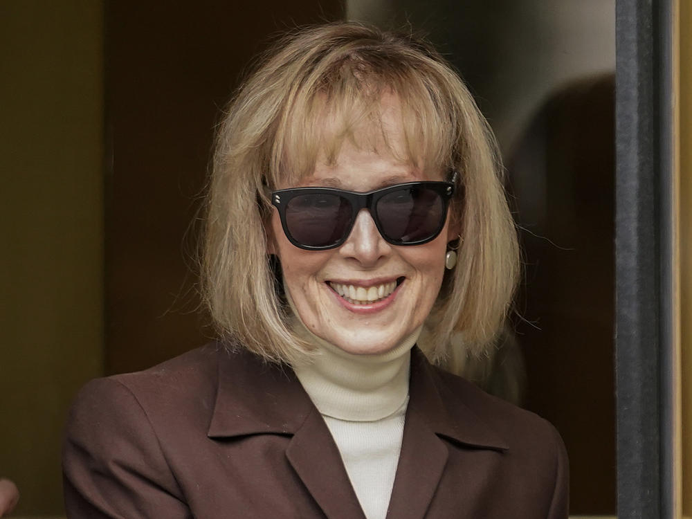 E. Jean Carroll walks out of federal court in Manhattan, May 9, 2023, in New York. A federal judge has denied former President Donald Trump's request for a new trial in the E. Jean Carroll defamation case.