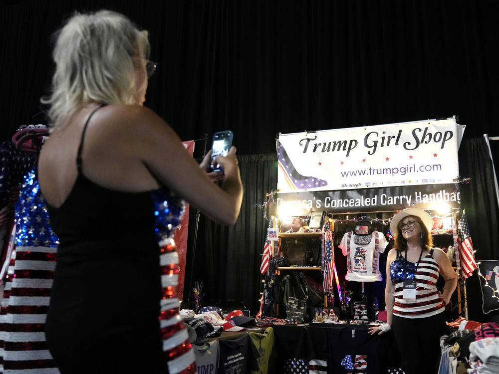 Theresa Hill, of Sarasota, Fla., poses for a photograph at her Trump Girl Shop during the Turning Point Action conference on July 15.