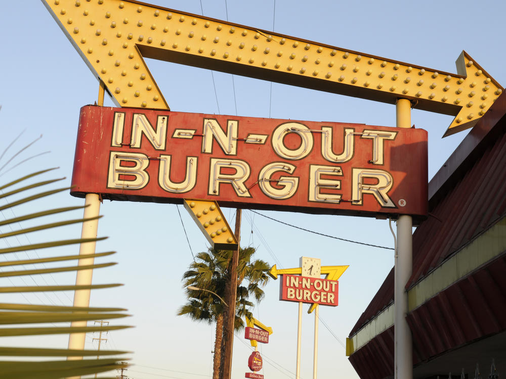 In-N-Out is barring employees in five states from wearing masks unless they have a doctor's note, according to internal company emails leaked on social media last week. An In-N-Out Burger signs is seen on June 8, 2010, in Baldwin Park, Calif.