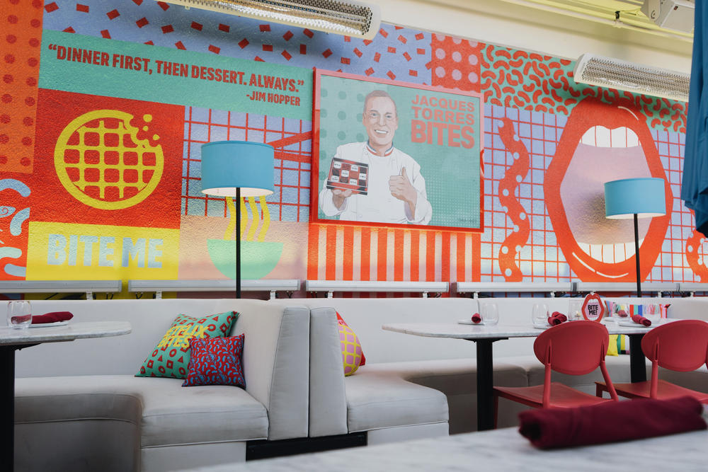 The interior of the Netflix Bites pop-up restaurant, at Short Stories hotel in Los Angeles, is a riot of color and Netflix branding.