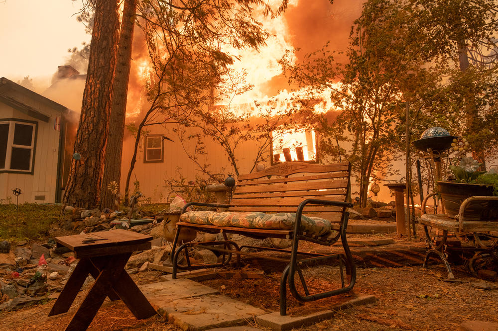A structure burns during the Oak Fire in Mariposa County last July.