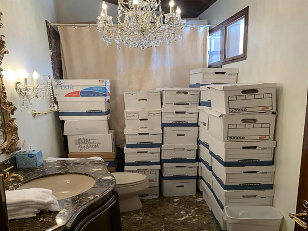 In this photo provided by the U.S. Department of Justice, stacks of boxes can be observed in a bathroom and shower in Mar-a-Lago's Lake Room in Palm Beach, Fla.