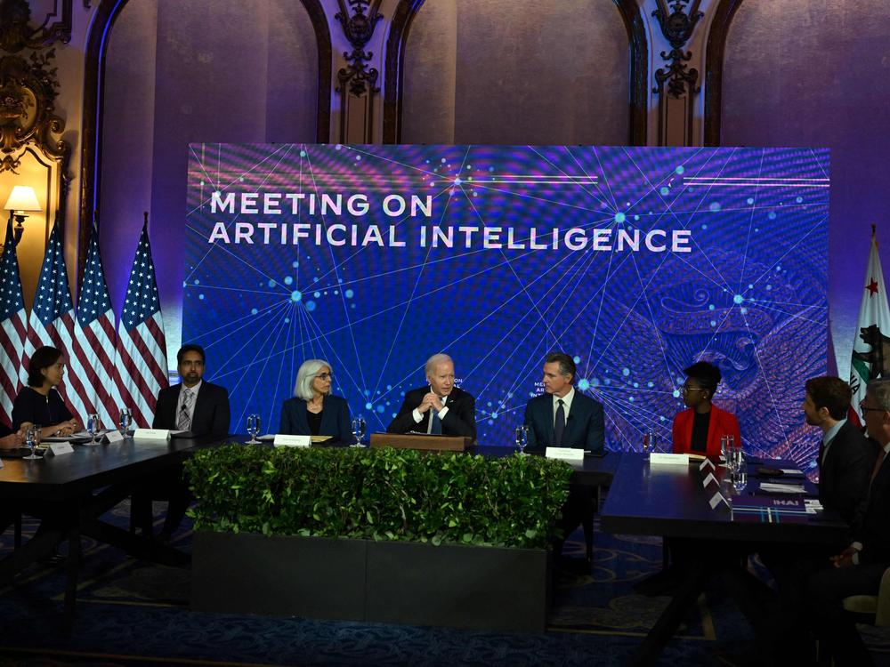 President Biden is pictured with leaders on artificial intelligence during a visit to San Francisco on June 20. On Friday, the White House announced voluntary agreements with technology companies on managing AI.